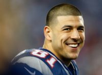 Former New England Patriots tight end Aaron Hernandez, pictured in December 2012, is currently serving a life sentence in prison without parole for murdering Odin Lloyd, a semi-pro football player in June 2013