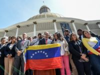 The president of Venezuela's National Assembly, Julio Borges (C), accompanied by opposition deputies, reads a statement in Caracas, on April 18, 2017