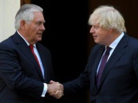 Britain's Foreign Secretary Boris Johnson, right, shakes hands with US Secretary of State, Rex Tillerson, outside Carlton Gardens in London, Friday May 26, 2017, ahead of their meeting. Washington's top diplomat Rex Tillerson was in London in an expression of solidarity, after Britain reacted furiously to leaks of sensitive details about the investigation into the May 22 bombing in Manchester, to US media. (Toby Melville/Pool Photo via AP)