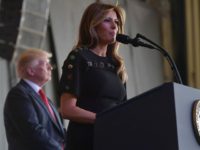 US First Lady Melania Trump address US military personnel and families at Naval Air Station Sigonella as US President Donald Trump stands on stage, after G7 summit of Heads of State and Government, on May 27, 2017 near Taormina in Sicily. / AFP PHOTO / MANDEL NGAN (Photo credit should read MANDEL NGAN/AFP/Getty Images)