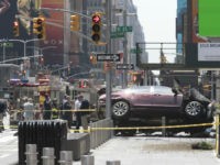 FILE - In this Thursday, May 18, 2017 file photo, a car rests on a security barrier in New York's Times Square after driving through a crowd of pedestrians, injuring at least a dozen people. A three-foot-tall piece of stainless steel in the ground ultimately stopped a speeding Honda Accord as it barreled down the crowded sidewalks of Times Square this week. In the wake of the rampage, some New Yorkers are calling for the installation of more protective bollards at the ends of city sidewalks to prevent similar incidents. (AP Photo/Mary Altaffer)