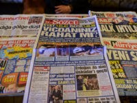 CORRECTION - This picture taken in Istanbul on April 17, 2017, shows the front pages of Turkish newspapers bearing headlines concerning referendum : Cumhuriyet (top-L) with a headline which translates as 'Shadow on cast', Sabah (top-R) with a headline which translates as ' People's revolution', Sozcu (C) with a headline which translates as 'Are your conscience confortable ?' and the Hurriyet (bottom R) with a headline which translates as 'New System'. The deputy leader of Turkey's opposition Republican People's Party (CHP) called on April 17, 2017 for the results of a referendum agreeing new powers for President Recep Tayyip Erdogan to be annulled. / AFP PHOTO / YASIN AKGUL / The erroneous mention appearing in the metadata of this photo by YASIN AKGUL has been modified in AFP systems in the following manner: [concerning referendum] instead of [concerning diplomatic tensions between Turkey and The Netherlands]. Please immediately remove the erroneous mention from all your online services and delete it from your servers. If you have been authorized by AFP to distribute it to third parties, please ensure that the same actions are carried out by them. Failure to promptly comply with these instructions will entail liability on your part for any continued or post notification usage. Therefore we thank you very much for all your attention and prompt action. We are sorry for the inconvenience this notification may cause and remain at your disposal for any further information you may require. (Photo credit should read YASIN AKGUL/AFP/Getty Images)