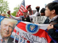 Supporters of President Donald Trump chant as they gather near the Intrepid Sea, Air & Space Museum, where Trump is expected to attend the 75th Anniversary Battle of the Coral Sea Commemorative Dinner on the USS intrepid, Thursday, May 4, 2017, in New York. (AP Photo/Julio Cortez)