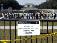 ILE - In this Oct. 2, 2013 file photo, despite signs stating that the national parks are closed, people visit the World War II Memorial in Washington. No government shutdown this year, Republican congressional leaders say. But with Congress, it's never easy. Conservatives are demanding a cutoff of Planned Parenthood's federal funds as their price for keeping agencies functioning beyond Sept. 30. A look at what's complicating the effort to avoid a shutdown. (AP Photo/Susan Walsh, File)