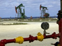 Oil pumpjacks, also known as nodding donkeys, operate at a state-owned Cupet SA facility along the northern coast of Cuba on Tuesday, March 16, 2010. The Greater Antilles, which includes Cuba, Haiti, the Dominican Republic, Puerto Rico and their offshore waters, probably hold at least 142 million barrels of oil and 159 billion cubic feet of gas, according to a 2000 report by the U.S. Geological Survey. Undiscovered amounts may be as high as 941 million barrels of oil and 1.2 trillion cubic feet of gas, according to the report. Photographer: Noah Friedman-Rudovsky/Bloomberg via Getty Images