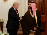 FILE -- In this March 14, 2017, file photo, President Donald Trump shakes hands with Saudi Defense Minister and Deputy Crown Prince Mohammed bin Salman, in the State Dining Room of the White House in Washington. Saudi Arabia is making every effort to dazzle and impress President Donald Trump on his first overseas trip. The kingdom wants to seize on the historic visit to cement itself as a major player on the world stage and shove aside rival Iran as a rogue state on the fringes of the Muslim world. (AP Photo/Evan Vucci, File)