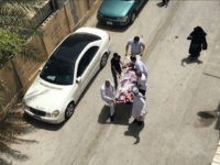 This image provided by an activist who requested to remain unnamed, shows people carrying a man who was injured in a raid on an sit-in, in Diraz, Bahrain, Tuesday, May 23, 2017. Bahrain police raided a town where the sit-in has been going on for months in support of Sheikh Isa Qassim, a prominent Shiite cleric, who had his citizenship stripped by the government. An activist said one protester was killed. Bahrain's Interior Ministry said on Twitter Tuesday that the operation targeting Diraz was to "maintain security and public order." (AP Photo)