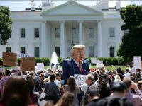 WASHINGTON, DC - MAY 10: A demonstrator wears a large effigy of President Donald Trump during a protest rally against President Donald Trump's firing of Federal Bureau of Investigation Director James Comey outside the White House May 10, 2017 in Washington, DC. Angry over the firing of Comey, about 300 demonstrators demanded that an independent special prosecutor investigate possible ties between the Trump campaign and Russian officials. (Photo by Chip Somodevilla/Getty Images)
