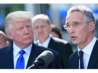 US President Donald Trump (L) listens to a speech by NATO Secretary General Jens Stoltenberg during the unveiling ceremony of the new NATO headquarters in Brussels, on May 25, 2017, during a NATO (North Atlantic Treaty Organization) summit. / AFP PHOTO / POOL AND BELGA / Christophe LICOPPE (Photo credit should read CHRISTOPHE LICOPPE/AFP/Getty Images)