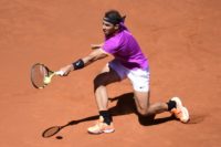 Spanish tennis player Rafael Nadal returns a ball to Serbian tennis player Novak Djokovic during their ATP Madrid Open semifinal match in Madrid, on May 13, 2017