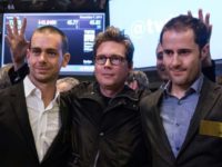 Twitter co-founder Biz Stone, at center in 2013 photo at the New York Stock Exchange debut of the social network, is flanked by co-founders Jack Dorsey, at left, and Ev Williams. Stone is returning to work at Twitter after a six-year hiatus