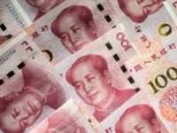 Moody's said it lowered its rating on China because of the likelihood of a 'material rise' in debt while potential economic growth slows