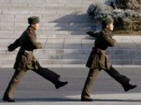 North Korean soldiers march in village of Panmunjom on the Demilitarized Zone (DMZ) dividing North and South Korea in November 2005. US lawmakers have submitted a bill to tightly restrict US travel to North Korea