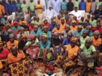 In this photo released by the Nigeria State House, Nigeria President, Muhammadu Buhari, centre, meets with Chibok school girls recently freed from Nigeria Extremist captivity in Abuja, Nigeria, Sunday, May 7, 2017. Five Boko Haram commanders were released in exchange for the freedom of 82 Chibok schoolgirls kidnapped by the extremist group three years ago, a Nigerian government official said Sunday, as the girls were expected to meet with the country's president and their families. (Bayo Omoboriowo/Nigeria State House via AP)