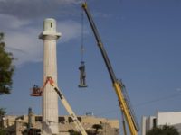 A statue of Confederate General Robert E. Lee is removed from Lee Circle Friday, May 19, 2017, in New Orleans. Lee's was the last of four monuments to Confederate-era figures to be removed under a 2015 City Council vote on a proposal by Mayor Mitch Landrieu. (AP Photo/Scott Threlkeld)