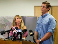 Patrick Hale, the man credited by law enforcement with forcing the surrender of two Georgia prison escapees, speaks to reporters in Murfreesboro, Tenn., on Friday, June 16, 2017, while his wife, Danielle, looks on. Hale said he was carrying a loaded weapon but never pulled it out when the two inmates got face down on his concrete driveway without saying a word. (AP Photo/Erik Schelzig)