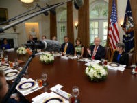 President Donald Trump hosts a working lunch with members of Congress, including Sen. Tom Cotton (R-AR) (R), Sen. Joni Ernst (R-IA) (2nd, R) and (L-R) White House Director of Legislative Affairs Mark Short, Sen. Pat Toomey (R-PA), Sen. Rob Portman (R-OH), Sen. John Thune (R-SD) and Sen. Lisa Murkowski (R-AK) at the White House June 13, 2017, in Washington, DC. Trump and lawmakers discussed administration plans to reform the Affordable Care Act, also known as Obamacare. (Photo by Mike Theiler-Pool/Getty Images)