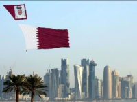 DOHA, QATAR - DECEMBER 18: Qatar Air Forces unfurl the flag of Qatar during the 137th anniversary celebrations of the Qatar's National Day in Doha, Qatar on December 18, 2015. Thousands of people have gathered along Doha's waterfront to celebrate Qatar's National Day. The annual holiday marks the date in 1878 when Sheikh Jassim bin Mohammed Al Thani succeeded his father and led the country towards unity. (Photo by Mohamed Farag/Anadolu Agency/Getty Images)