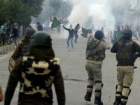 Kashmiri protestors clash with Indian government forces after Eid prayers in downtown Srinagar on June 26, 2017. The Islamic fasting month of Ramadan, which ended with the Eid al-Fitr feast, was particularly bloody one for mainly Muslim Kashmir. Fifty-one people were killed this Ramadan in the restive region according to Khurram Parvez from the Jammu Kashmir Coalition of Civil Society, which monitors conflict-related deaths. / AFP PHOTO / TAUSEEF MUSTAFA (Photo credit should read TAUSEEF MUSTAFA/AFP/Getty Images)