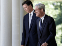 WASHINGTON, DC - JUNE 21: James Comey (L) FBI Director nominee walks with outgoing FBI Director Robert Mueller (R) to a ceremony annoucing Comey's nomination in the Rose Garden at the White House June 21, 2013 in Washington, DC. Comey, a former Justice Department official under President George W. Bush, would replace Mueller. (Photo by Win McNamee/Getty Images)