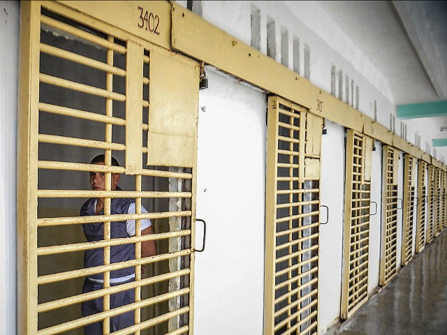 A Cuban inmate remains in his cell at the maximum security 'Combinado del Este' prison, in Havana, on April 9, 2013. Cuban authorities organized a visit for the international media --the only one in the last nine years-- to the biggest prison in Cuba, to show the press the prison population's health and education condition. AFP PHOTO/Adalberto ROQUE (Photo credit should read ADALBERTO ROQUE/AFP/Getty Images)