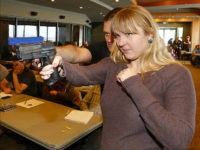 WEST VALLEY CITY, UT - DECEMBER 27: Joanna Baginska (R), a fourth grade teacher at Odyssey Charter School in American Fork, Utah is shown how to handle a 40 cal. Sig Sauer by firearm instructor Clark Aposhian at a concealed-weapons training class to 200 Utah teachers on December 27, 2012 in West Valley City, Utah. The Utah Shooting Sports Council said it would waive its $50 fee for concealed-weapons training for Utah teachers. (Photo by George Frey/Getty Images)