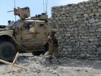 A US soldier patrols near the site of a US bombing during an operation against Islamic State (IS) militants in the Achin district of Nangarhar province on April 15, 2017. Afghan authorities April 15 reported a jump in fatalities from the American military's largest non-nuclear bomb, declaring some 90 Islamic State fighters dead, as US-led forces conducted clean-up operations over their mountain hideouts. Dubbed the 'Mother Of All Bombs', the GBU-43/B Massive Ordnance Air Blast was unleashed in combat for the first time April 12, hitting IS positions in a remote area of eastern Nangarhar province. / AFP PHOTO / NOORULLAH SHIRZADA (Photo credit should read NOORULLAH SHIRZADA/AFP/Getty Images)