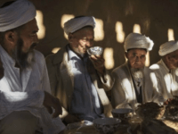 TURPAN, CHINA - SEPTEMBER 13: (CHINA OUT) Uyghur men gather for a holiday meal during the Corban Festival on September 13, 2016 in Turpan County, in the far western Xinjiang province, China. The Corban festival, known to Muslims worldwide as Eid al-Adha or 'feast of the sacrifice', is celebrated by ethnic Uyghurs across Xinjiang, the far-western region of China bordering Central Asia that is home to roughly half of the country's 23 million Muslims. The festival, considered the most important of the year, involves religious rites and visits to the graves of relatives, as well as sharing meals with family. Although Islam is a 'recognized' religion in the constitution of officially atheist China, ethnic Uyghurs are subjected to restrictions on religious and cultural practices that are imposed by China's Communist Party. Ethnic tensions have fueled violence that Chinese authorities point to as justification for the restrictions. (Photo by Kevin Frayer/Getty Images)
