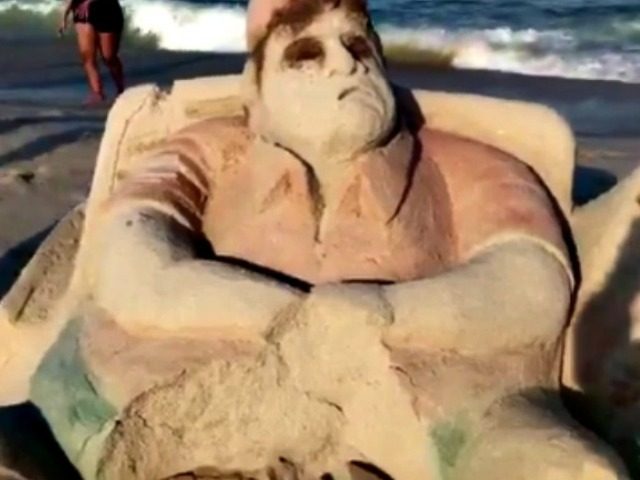 Artists create sand sculpture of Chris Christie lounging in beach chair