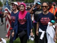 Activist Linda Sarsour (C) and fellow gun-control activists participate in a march beginning at the headquarters of National Rifle Association July 14, 2017 in Fairfax, Virginia. Women's March holds a two-day rally and march from the NRA headquarters to the Justice Department in Washington, DC, to protest the association's 'incendiary and racist actions.' (Photo by Alex Wong/Getty Images)