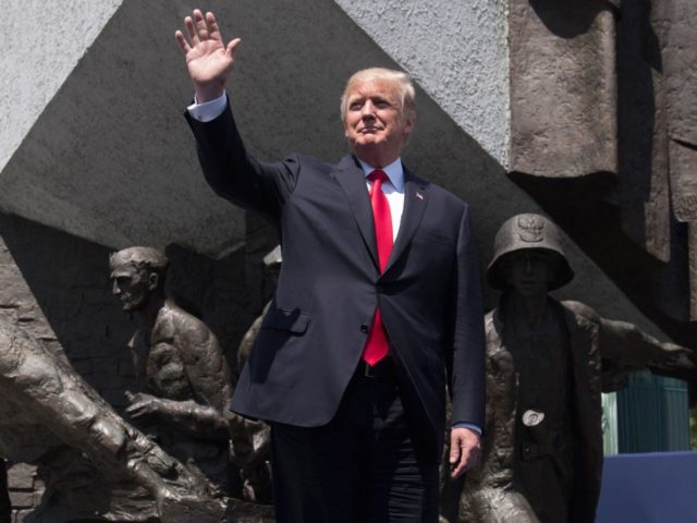 Trump Warsaw wave (Saul Loeb / AFP / Getty)