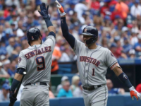 Carlos Correa of the Houston Astros is congratulated by Marwin Gonzalez after hitting a solo home run in the second inning during MLB game action against the Toronto Blue Jays July 9, 2017
