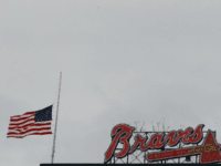 An American flag is lowered to half-staff at Turner Field in memory of a fan, Greg Murrey, who fell to his death at an Atlanta Braves game on August 29, 2015