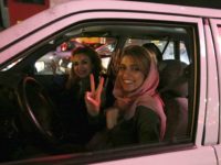 Women in a car flash the 'V for Victory' sign as they celebrate on Valiasr street in northern Tehran on April 2, 2015, after the announcement of an agreement on Iran nuclear talks. Iran and global powers sealed a deal on April 2 on plans to curb Tehran's chances for getting a nuclear bomb, laying the ground for a new relationship between the Islamic republic and the West. AFP PHOTO / ATTA KENARE (Photo credit should read ATTA KENARE/AFP/Getty Images)