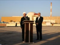 In this photo released by the Iranian Presidency Office, President Hassan Rouhani, left, speaks as he is accompanied by the head of Iran's Atomic Energy Organization Ali Akbar Salehi during his visit to the Bushehr nuclear power plant just outside the port city of Bushehr, southern Iran, Tuesday, Jan. 13, 2015. (AP Photo/Iranian Presidency Office, Mohammad Berno)