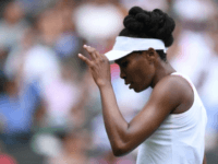 US player Venus Williams reacts between games against Belgium's Elise Mertens during their women's singles first round match on the first day of the 2017 Wimbledon Championships in London July 3, 2017