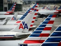 American Airlines reported a dip in second-quarter profits but offered a positive outlook
