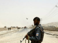 An Afghan policeman stands guard near to the site of a suicide bomber struck at a NATO convoy in Kandahar southern of Kabul, Afghanistan, Wednesday, Aug. 2, 2017. A suicide bomber struck a NATO convoy near the southern Afghan city of Kandahar on Wednesday, causing casualties, the U.S. military said. (AP Photo)