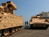 Lebanese soldiers guard US made Bradley Fighting Vehicles at the port of Beirut on August 14, 2017. The US Army is sending a total of 50 Bradley armored vehicles to the Lebanese army as it is assisting the latter with weapons, equipment and training to boost its capabilities. / AFP PHOTO / PATRICK BAZ (Photo credit should read PATRICK BAZ/AFP/Getty Images)