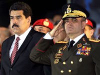 Venezuelan President Nicolas Maduro (C), First Lady Cilia Flores (L) and Defense Minister Vladimir Padrino Lopez (R) attend the commemoration of the 190 years of the Battle of Ayacucho and grade promotion ceremony of the Bolivarian National Armed Forces at the National Pantheon in Caracas, on December 9, 2014. AFP PHOTO/FEDERICO PARRA (Photo credit should read FEDERICO PARRA/AFP/Getty Images)