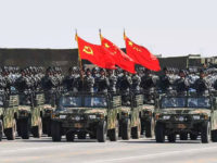 XILINGOL, CHINA - JULY 30: The flag guard formation holding the flag of the Communist Party of China, the national flag and the flag of the PLA attends a military parade at Zhurihe military training base to mark the 90th birthday of Chinese People's Liberation Army (PLA) on July 30, 2017 in Xilingol League, Inner Mongolia Autonomous Region of China. China held on Sunday its first Army Day parade one day before the 90th birthday of PLA. (Photo by Cui Nan/CHINA NEWS SERVICE/VCG via Getty Images)