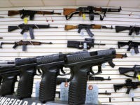 FILE - In this Jan. 16, 2013 file photo, assault weapons and handguns are seen for sale at Capitol City Arms Supply in Springfield, Ill. In a questionnaire for The Associated Press, the four GOP candidates for governor, state Sens. Bill Brady and Kirk Dillard, state Treasurer Dan Rutherford and businessman Bruce Rauner disagree on whether assault-style weapons should be banned. They also disagree on whether to support a measure creating minimum prison sentences for gun crimes.Mississippi (AP Photo/Seth Perlman, File)