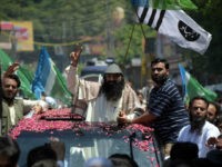 Senior leader of Kashmiri militant group Hizb-ul-Mujahideen Syed Salahuddin gestures as he arrives for a press briefing in Muzaffarabad on July 1, 2017. Pakistan June 27 strongly criticised the US decision to impose sanctions on Syed Salahuddin, senior leader of the Kashmiri militant group Hizb-ul-Mujahideen. 'The designation of individuals supporting the Kashmiri right to self-determination as terrorists is completely unjustified,' the foreign office said in a statement. / AFP PHOTO / SAJJAD QAYYUM (Photo credit should read SAJJAD QAYYUM/AFP/Getty Images)