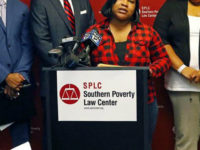 Dorothy Haymer of Yazoo City, at podium, Indigo Williams, left and Precious Hughes, right. both of Jackson, explains the reasons as African-American mothers of children in public elementary schools, they are plaintiffs in a Mississippi education lawsuit filed on her behalf, by the Southern Poverty Law Center, Tuesday, May 23, 2017, in Jackson, Miss. Mississippi is denying good schools to African American students and violating the federal law that enabled the state to rejoin the union after the Civil War, the Southern Poverty Law Center alleged Tuesday in a lawsuit trying to strengthen constitutional protections for education. (AP Photo/Rogelio V. Solis) (AP Photo/Rogelio V. Solis)