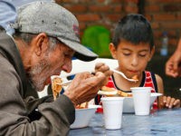 Venezuelans get food at the Casa de Paso Divina Providencia refuge in Cucuta, Colombia on July 31, 2017. The United States, Mexico, Colombia, Peru and other nations said they did not recognize the results of the election Sunday of a new 'Constituent Assembly' superseding Venezuela's legislative body, the opposition-controlled National Assembly. / AFP PHOTO / SCHNEYDER MENDOZA (Photo credit should read SCHNEYDER MENDOZA/AFP/Getty Images)