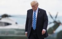 US President Donald Trump walks from Marine One to board Air Force One prior to departing from Hagerstown, Maryland, on August 18, 2017, following meetings at Camp David and before returning to Bedminster, New Jersey to continue his vacation
