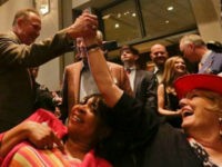 Former Alabama Chief Justice and U.S. Senate candidate Roy Moore, greets supporter Patricia Jones, right, before his election party, Tuesday, Sept. 26, 2017, in Montgomery, Ala.(AP Photo/Brynn Anderson)