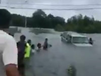 Drivers Form Human Chain to Rescue Elderly Man Caught in Houston Floodwaters