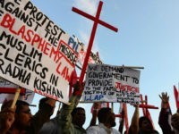 Pakistani Christians shout slogans in protest against the killing of Christian couple, in Islamabad on November 5, 2014. An enraged Muslim mob beat a Christian couple to death in Pakistan and burnt their bodies in the brick kiln where they worked for allegedly desecrating a Koran, police said. AFP PHOTO/Farooq NAEEM (Photo credit should read FAROOQ NAEEM/AFP/Getty Images)