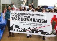 Protesters begin to march at the Durham County jail toward the site of the toppled Confederate monument on Main St., Tuesday, Sept. 12, 2017, in Durham, N.C, after a court hearing for several activists who were charged in toppling the monument. The protest was organized for a national week of action because Sept. 12 is also the one-month anniversary of the murder of anti-fascist protester Heather Heyer in Charlottesville, Va. (Casey Toth/The Herald-Sun via AP)
